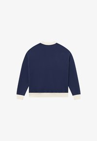 Tengerészkék pulóver krémszínű díszítéssel, kerek nyakkivágással, hosszú ujjakkal és bordázott mandzsettákkal. Puha anyagból, kényelmes, laza szabású.