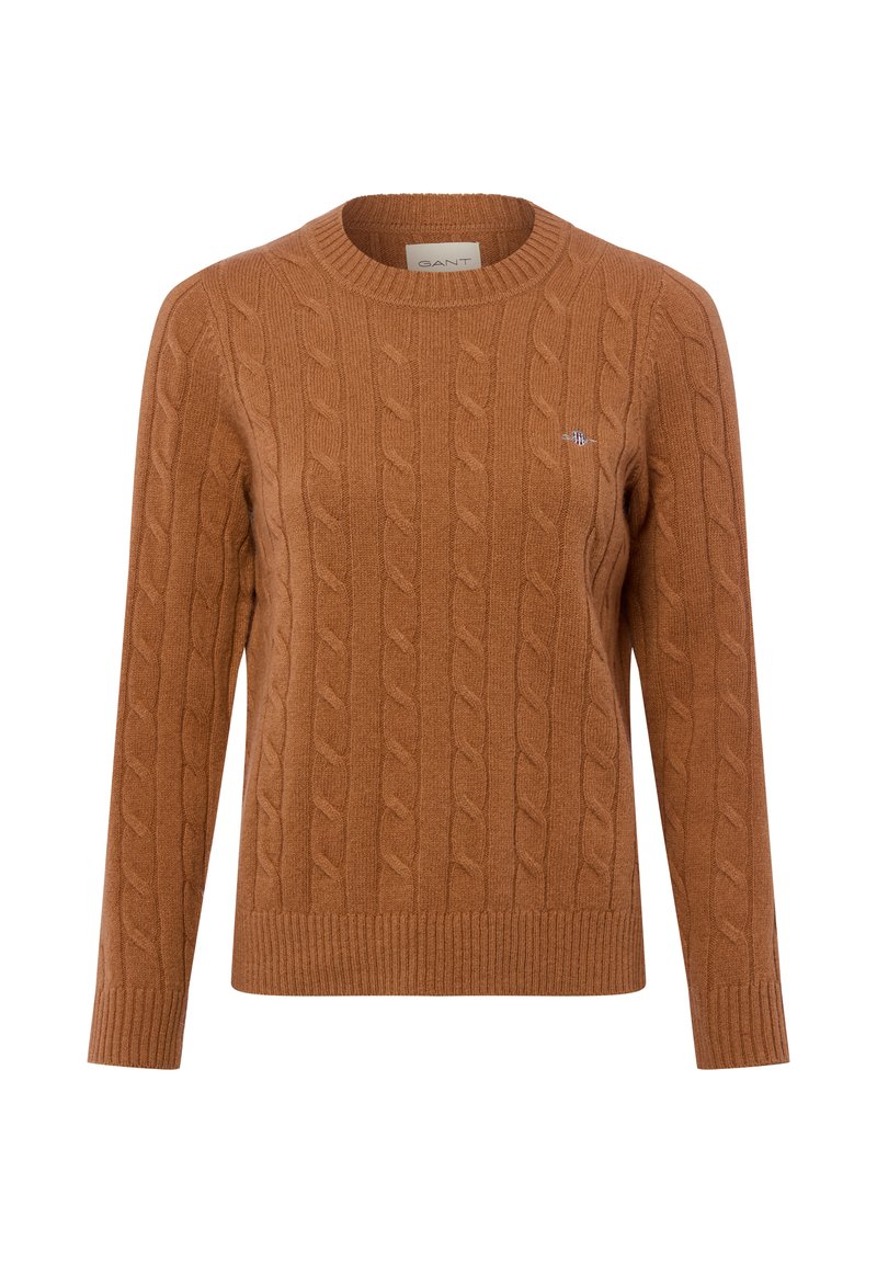 Pull en tricot marron avec un col rond et un ourlet côtelé. Il présente un logo brodé sur la poitrine et des manches longues. Texture douce.