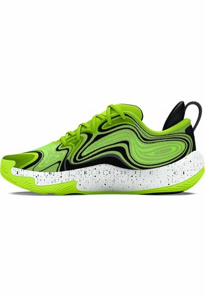 Zapatilla deportiva verde lima con un patrón negro ondulado, media suela salpicada de blanco y acentos texturizados en negro. Equipadas con una lengüeta en la parte trasera.