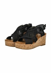 Schwarze geflochtene Sandalen mit Kork-Absatz. Mit Kreuzgurten und verstellbarem Knöchelriemen. Textiloberfläche und glatte Innensohle.
