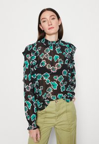 Schwarze Bluse mit Blumenmuster in Türkis und Grün, mit Rüschenärmeln und gerafftem Halsausschnitt. Leichtes, durchscheinendes Material mit fließendem Design.