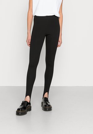 STIRRUP - Leggings - black