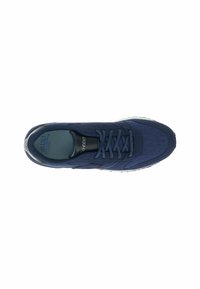 Blue athletic shoe with a textured fabric upper, lace-up design, padded collar, and a flexible white sole. Lightweight and streamlined shape.