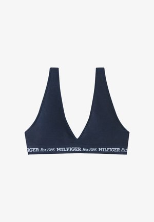 Bralette blu navy a coste con scollo a V profondo e fascia elastica con la scritta "HILFIGER Est.1985" in bianco.