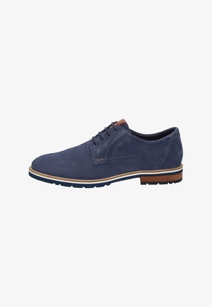 Marineblaues Wildleder-Eleganzschuh mit runder Zehenform, Schnürdesign und kontrastierender beiger Sohle. Hat ein kleines braunes Akzent am Obermaterial.