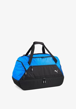 Blauer und schwarzer Puma-Sport-Duffelbag mit zwei Griffen, mehreren Reißverschlussfächern und dem Puma-Logo auf der Vordertasche.