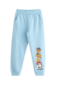 Helleblaue Jogginghose aus einem Baumwollmischgewebe mit elastischem Bund und Bündchen. Mit bunten Paw Patrol-Charakteren, die an der Seite bedruckt sind.