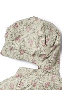 Kvetinový dáždnik z ľahkej vzorovanej látky v svetlozelenej farbe s ružovými a bielymi kvetmi, s gombíkovými zapínaniami a nariasenými okrajmi.