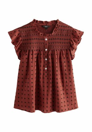 Rode stoffen top met korte ruches mouwen, met een smock-borstvoorset, knopen aan de voorkant en zwarte vierkante patronen overal.