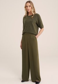 WE Fashion Auduma bikses - green
