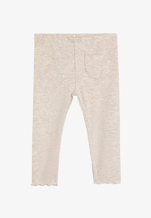 Light beige ribbed leggings with a scalloped hem and a single back pocket. Made from soft, textured fabric for comfort.