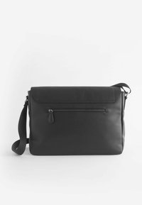 Black leather messenger bag with a flap closure, adjustable shoulder strap, and a front zippered pocket. Smooth texture, minimalist design.