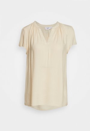 Short-sleeve, light beige blouse with a V-neck and gathered neckline details. Features a textured, slightly crinkled fabric and curved hem.