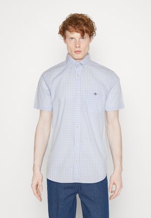 Short-sleeve, blue and white gingham check shirt with a button-down collar, featuring a chest pocket and subtle logo detail.