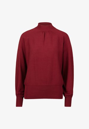 Bordeaux pullover sweater med høj hals, plisseret detalje ved halsen samt ribbede manchetter og nederste kant. Blødt strikstof.