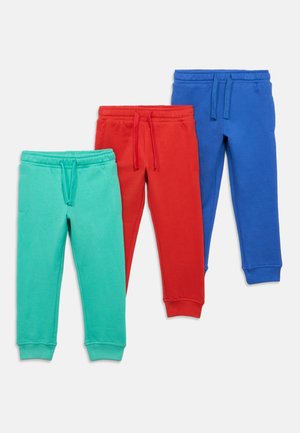Tre par joggebukser i turkis, rød og blå. Laget av mykt stoff med elastiske midjebånd og mansjetter. Justerbare snorer i midjen.