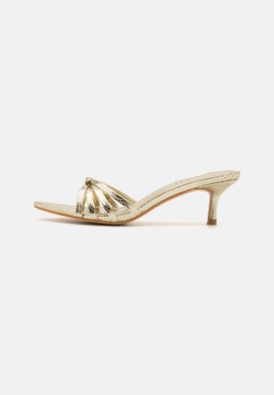 GINNY - Heeled mules - gold-coloured