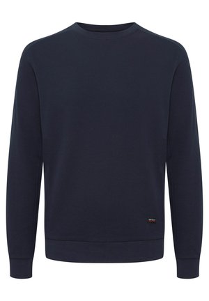 Sweatshirt bleu marine avec un design en tricot texturé, col rond, manches et ourlet côtelés. Détail de petit logo sur le côté inférieur.