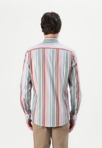 Long-sleeve shirt featuring vertical stripes in red, green, lavender, and white. Buttoned cuffs, collar, and a curved hemline.