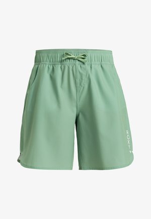 Světlé zelené sportovní šortky s elastickým pasem a šňůrkou. Obsahují dvě boční kapsy a bílé logo "Roxy" na levé noze.