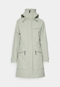 Giacca impermeabile verde chiaro con colletto alto, tasche con zip, polsini regolabili e tessuto liscio e testurizzato.