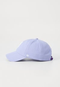 Purple cotton baseball cap with a curved visor, embroidered logo on the front, and a tag on the back. Smooth texture throughout.