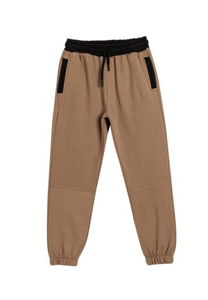 Beige Jogginghose mit schwarzem elastischem Bund und Seitentaschen. Hergestellt aus weichem Stoff, mit gerippten Bündchen und einer lockeren Passform.