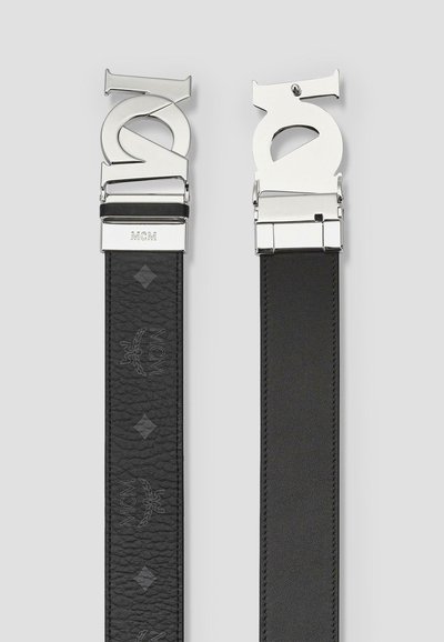Black leather belt featuring a metallic buckle with stylized lettering and logo. Smooth texture with embossed detailing along the strap.
