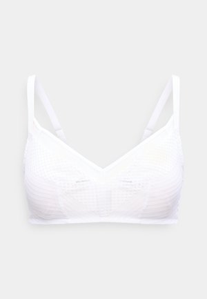 White wireless bra with adjustable thin straps and textured fabric pattern on a plain light background.