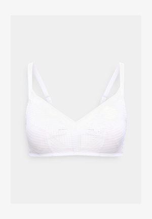 Valge juhtmevaba rinnahoidja reguleeritavate õhukeste rihmade ja tekstuurse kangamustriga tavalise heleda tausta peal.