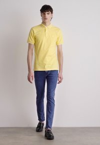 BOSS PASSERTIP - Polo - bright yellow