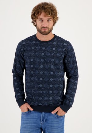 Sudadera con patrón marino hecha de un tejido texturizado que presenta diseños geométricos, mangas largas y un cuello redondo con puños y dobladillo de canalé.