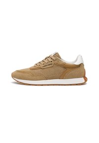 Tan athletic shoes with suede and mesh materials, featuring rounded toe, flat lace-up design, and white heel accent. Gum sole.