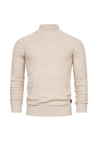 Suéter de punto color crema con cuello alto, que presenta un patrón de olas texturizado, mangas largas y un dobladillo acanalado ajustado.