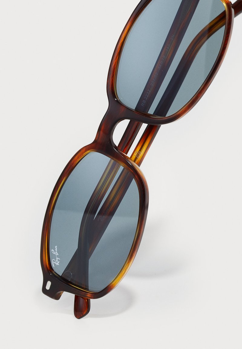 Brown Ray-bans with dark blue tinted lenses. Ray-Ban RX5375 Brown/Tortoise/Blue Eyeglasses | Includes  main image 4