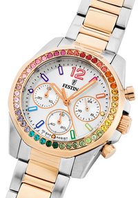 Festina chronografas su sidabriniu ciferblatu, rožinės aukso ir sidabro metalinėmis apyrankėmis, ir daugiakampiu, dekoruotu daugiakampiais kristalais. Yra trys mažieji ciferblatai.