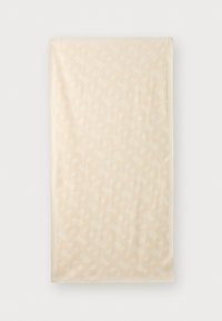 Copriletto decorativo beige con un motivo geometrico testurizzato, tessuto morbido e bordi rifiniti. La dimensione e la texture offrono calore.