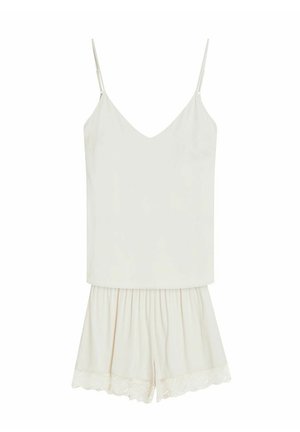 Biały damski kombinezon bez rękawów z regulowanymi cienkimi ramiączkami i szortami wykończonymi koronką, zaprojektowany do noszenia na co dzień lub jako piżama.