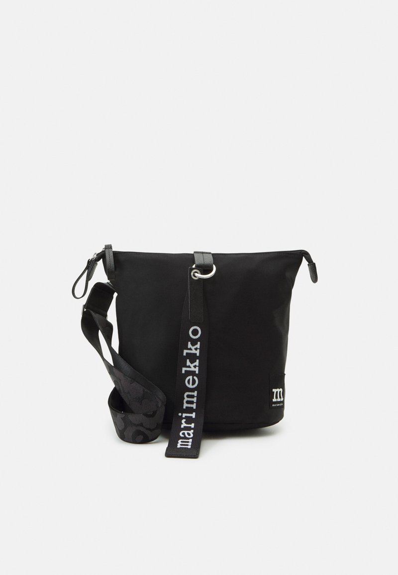 Black nylon shoulder bag with a zip closure, textured strap featuring a pattern, and logo label on the front. Adjustable strap included.
