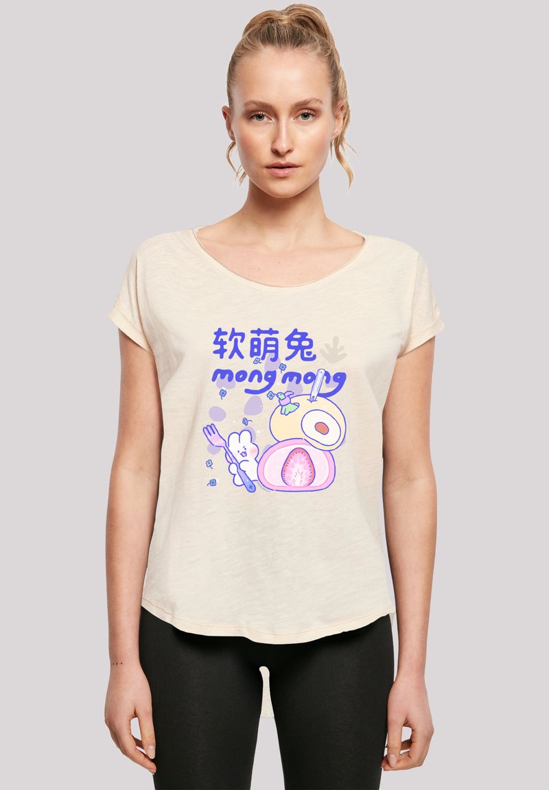 Light beige scoop-neck t-shirt featuring a colorful cartoon graphic of food and a bunny, with text in blue and purple. Soft texture, relaxed fit.