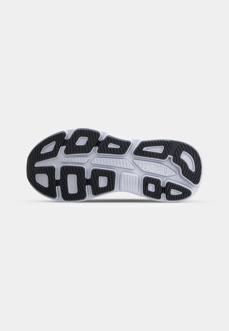 Black and white athletic shoe sole with rubber outsole, patterned grip, and flexible grooves for enhanced traction and comfort.