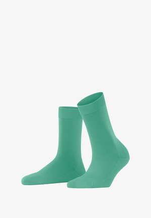 Grüne Baumwollsocken mit glatter Textur, geripptem Bündchen und mittellangem Design, geeignet für den Alltag.
