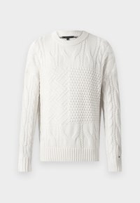 Fehér kötött pulóver különböző textúrákkal, kerek nyakkivágással, valamint bordás mandzsettákkal és aljjal. Simára végzett, egyszínű.