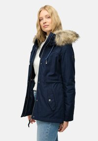 Navy blue parka jacket with faux fur hood, drawstring closure, two front pockets, and a zippered front. Durable fabric with a matte finish.