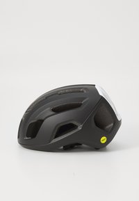 Casque de vélo noir avec des trous de ventilation, une finition mate et un label MIPS. Le design est aérodynamique avec une forme arrondie.