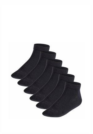 Six pairs of black ankle socks arranged diagonally on a white background, showing ribbed cuffs and smooth knit texture.