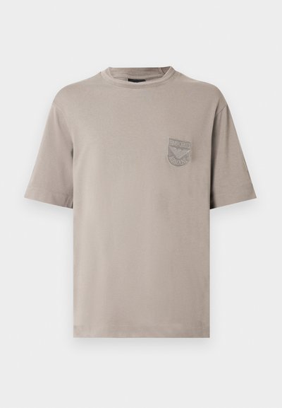 Gray cotton T-shirt with short sleeves, round neckline, and small chest pocket featuring embroidered brand logo. Soft texture and relaxed fit.