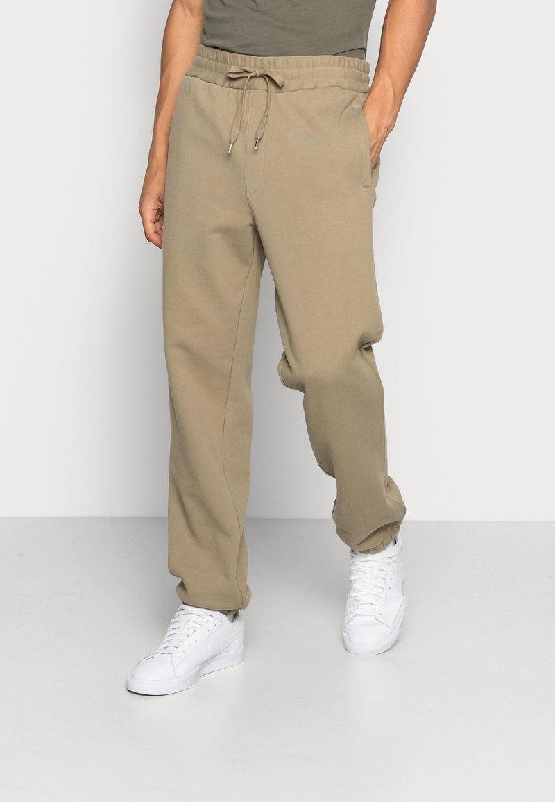 ARKET Calças de fato de treino - khaki green
