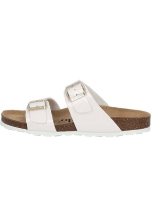 Sandale blanche à deux brides avec boucles métalliques réglables, semelle en liège et semelle en caoutchouc texturé. Matériau supérieur lisse avec des accents minimaux.