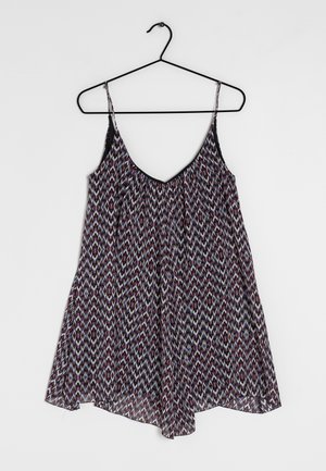 Fließendes ärmelloses Kleid mit einem schwarzen oberen Rand und einem mehrfarbigen Zickzackmuster. Der Stoff wirkt leicht und hat eine lockere Passform, die sanft fällt.